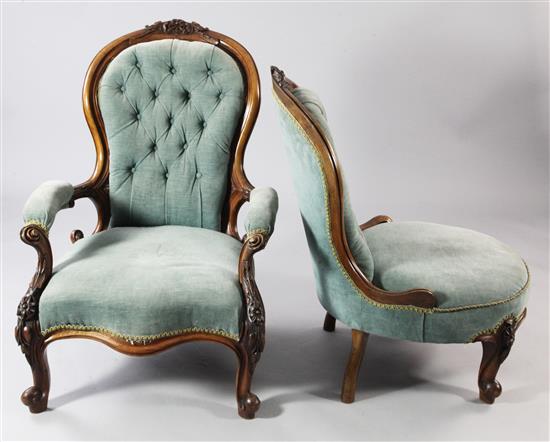 A pair of Victorian carved walnut ladies and gentlemens button back chairs,